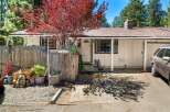 Charming home with a welcoming facade, featuring a well-maintained exterior and a lovely front yard.