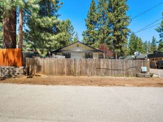 Charming home nestled in a serene, tree-lined neighborhood.