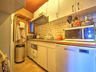 This charming kitchen offers a cozy and functional space, perfect for preparing meals.