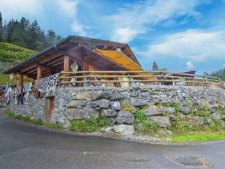 Nestled in a picturesque location, this property boasts a unique architectural design with a rustic charm.