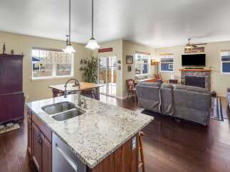 This stunning property boasts a spacious open-concept living area, perfect for entertaining.