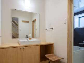 This modern bathroom features a sleek design with natural wood elements.
