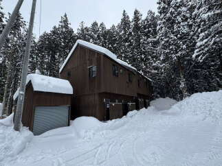 Nestled in a winter wonderland, this stunning property offers a serene escape.