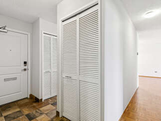 Step into this inviting entryway, featuring a combination of stylish design and practical storage solutions.