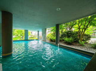 Experience tranquility in this stunning property featuring a serene water feature.