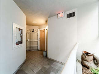 This inviting hallway showcases a well-maintained property with a focus on safety and convenience.