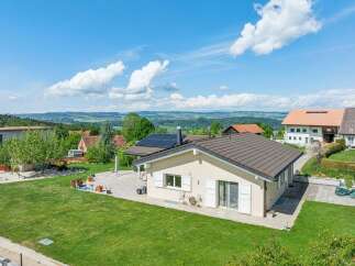 This stunning property offers a perfect blend of modern living and natural beauty.