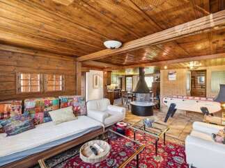Step into rustic elegance with this stunning property, boasting a warm and inviting living space.