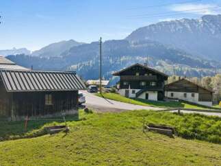 Nestled in a picturesque mountain setting, this charming property offers a tranquil escape.