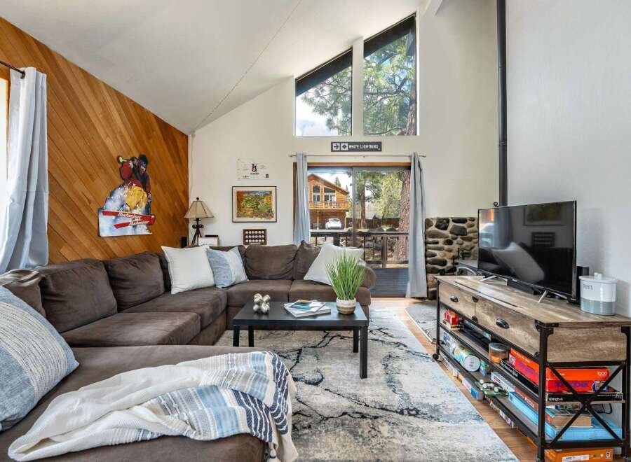 This cozy living room features a comfortable sectional sofa, perfect for relaxing after a day of exploring.