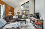 This cozy living room features a comfortable sectional sofa, perfect for relaxing after a day of exploring.
