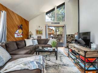 This cozy living room features a comfortable sectional sofa, perfect for relaxing after a day of exploring.