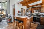 This charming kitchen boasts a cozy breakfast bar with seating, perfect for casual dining and entertaining.