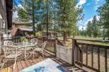 Enjoy the serene beauty of this property with a charming outdoor deck, perfect for relaxation and entertaining.