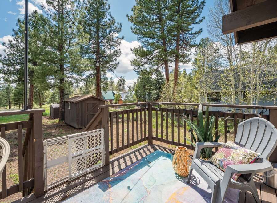 Enjoy the tranquility of this charming property with a beautiful deck overlooking a lush landscape.
