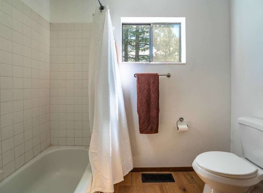 This charming bathroom features a classic design with a clean and inviting atmosphere.