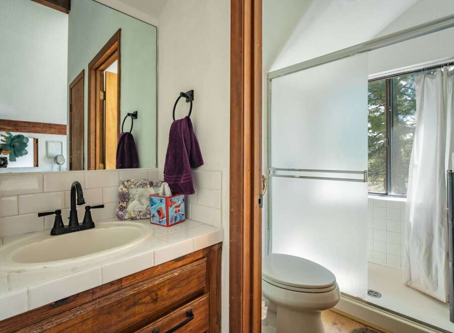 This charming bathroom features a classic design with a touch of warmth.