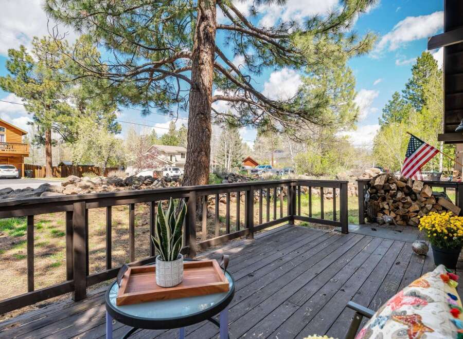 Enjoy the tranquility of this charming property featuring a spacious deck perfect for relaxation and outdoor gatherings.