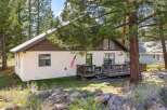Nestled amidst the serene beauty of nature, this charming property offers a tranquil retreat.