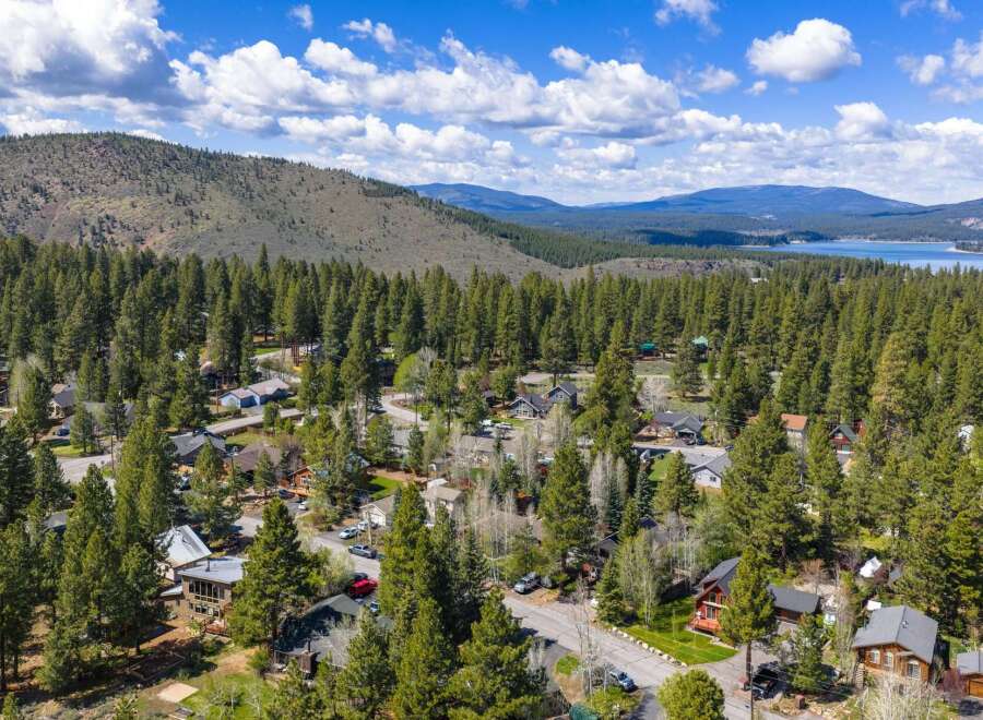 Nestled amidst a lush forest, this property offers a serene escape with stunning views.