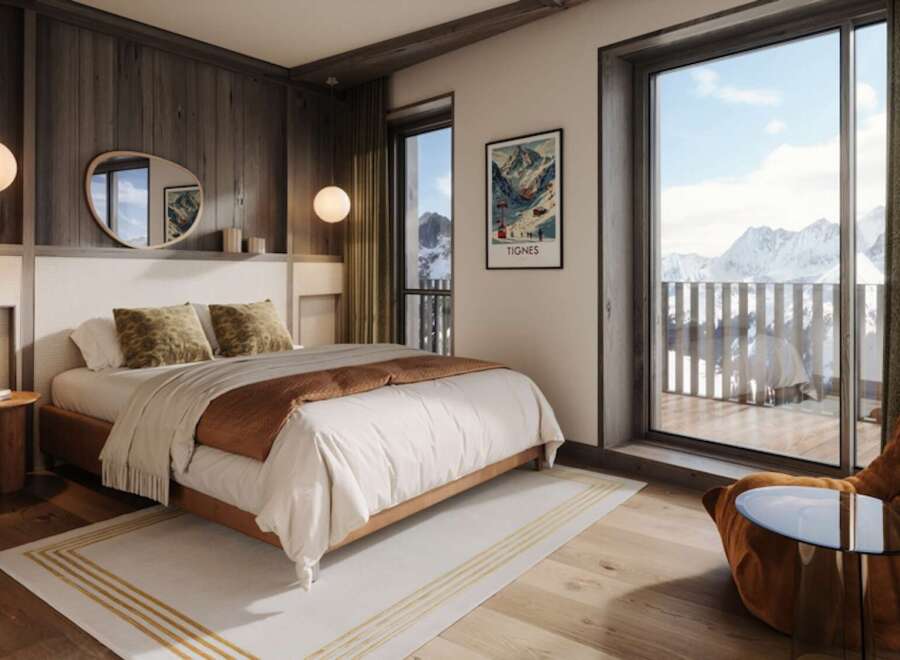 Experience luxury living in this stunning bedroom with breathtaking mountain views.