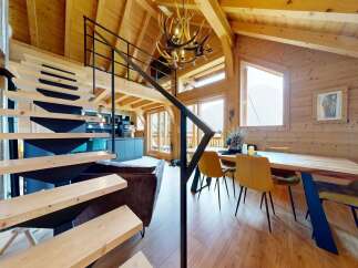 Step into luxury with this stunning chalet-style home, boasting a unique blend of rustic charm and modern design.