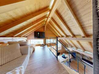 Discover the charm of this stunning loft space, featuring a warm, inviting wooden interior.