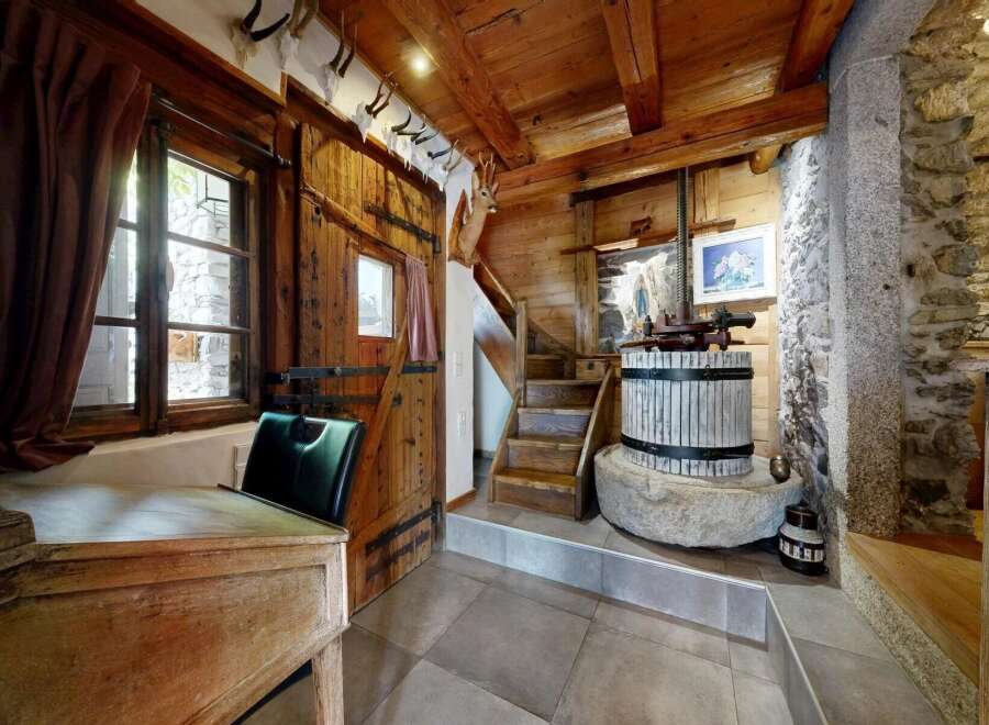 Step into rustic charm with this unique property, featuring a beautifully crafted wooden interior.
