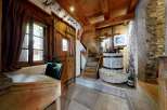 Step into rustic charm with this unique property, featuring a beautifully crafted wooden interior.