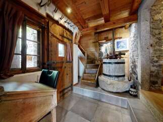 Step into rustic charm with this unique property, featuring a beautifully crafted wooden interior.