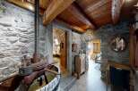 Step into rustic charm with this stunning property featuring exposed stone walls and wooden beams.