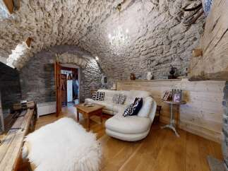 Step into rustic elegance with this stunning property! Featuring a unique stone wall interior and a cozy, inviting atmosphere, this home offers a blend of charm and modern comfort.