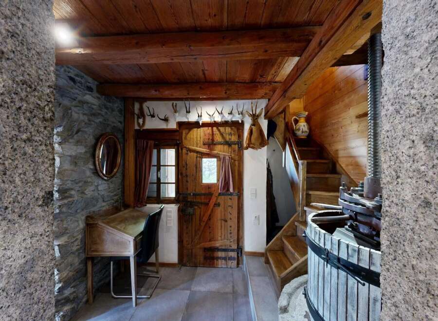 Step into rustic charm with this unique property, showcasing a blend of traditional design and modern comfort.