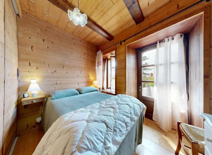 Step into a cozy bedroom retreat with rustic charm.