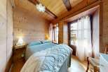 Step into a cozy bedroom retreat with rustic charm.