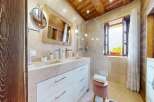Step into luxury with this stunning bathroom featuring a double vanity and a spacious shower.