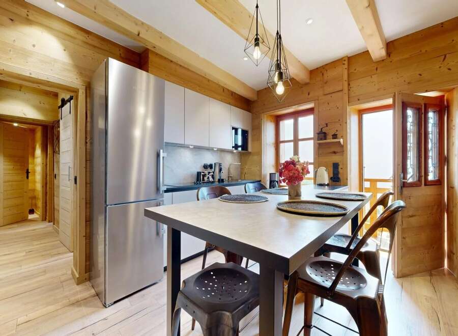 This stunning property boasts a beautifully designed kitchen with modern appliances and a stylish dining area.