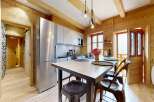 This stunning property boasts a beautifully designed kitchen with modern appliances and a stylish dining area.