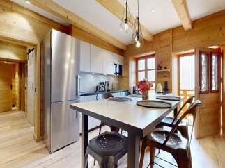 This stunning property boasts a beautifully designed kitchen with modern appliances and a stylish dining area.