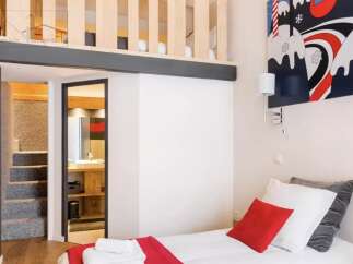 Discover this charming property featuring a cozy bedroom with a loft area, perfect for maximizing space.