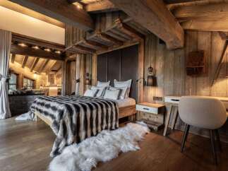 Experience rustic luxury in this stunning bedroom.