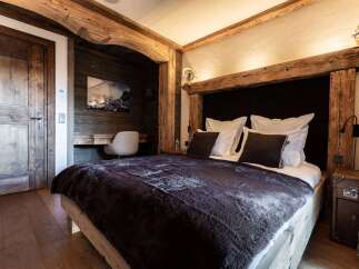 Experience rustic elegance in this stunning bedroom.