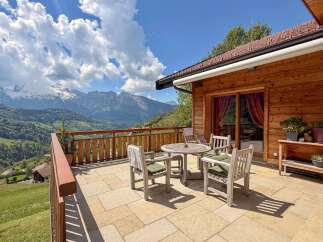 Experience breathtaking mountain views from this charming property.