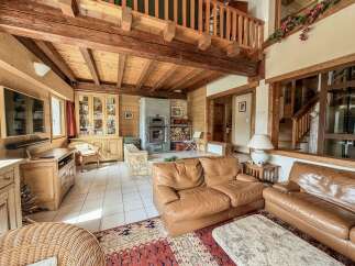 Step into rustic elegance with this stunning property, showcasing a warm and inviting living space.