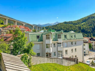 Discover a stunning property nestled in a picturesque location, offering breathtaking views of the surrounding mountains and lush greenery.