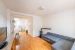 Discover this charming property featuring a cozy living space with a comfortable sofa and a unique fireplace.