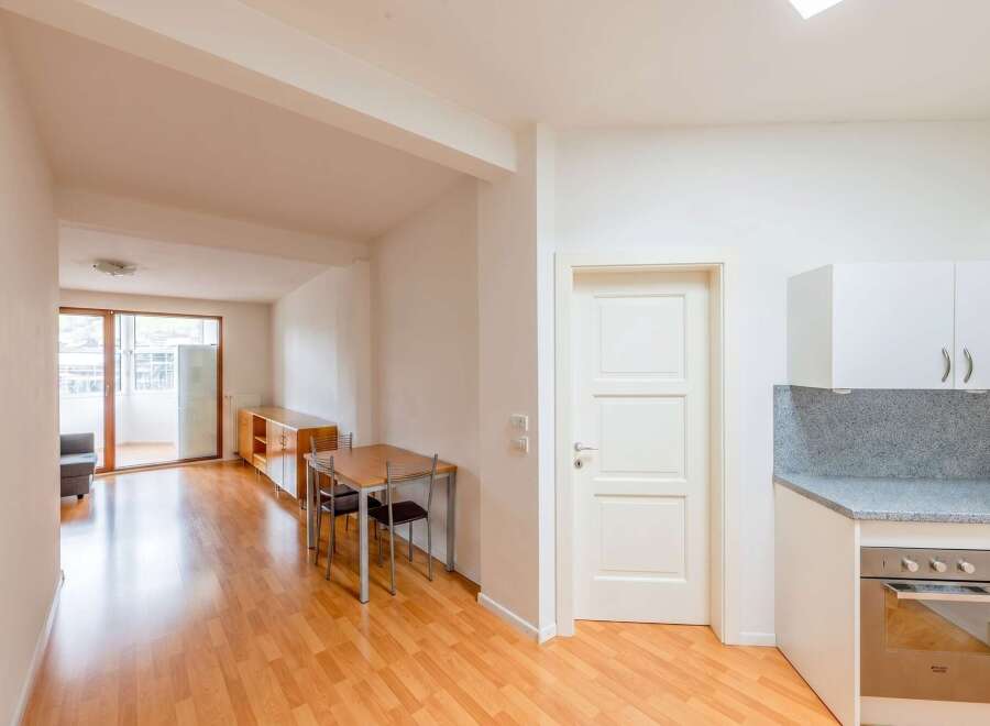 Discover this inviting property featuring a well-lit living space with beautiful hardwood floors.