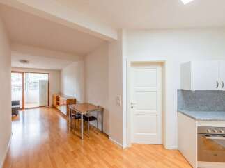 Discover this inviting property featuring a well-lit living space with beautiful hardwood floors.