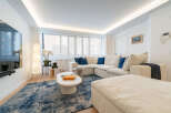 Step into luxury with this stunning living space! Featuring a modern sectional sofa, a stylish coffee table, and a plush rug, this home offers both comfort and elegance.