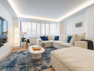 Step into luxury with this stunning living space! Featuring a modern sectional sofa, a stylish coffee table, and a plush rug, this home offers both comfort and elegance.